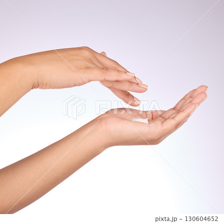 Hands, moisturizer and beauty, skincare and woman, manicure and nail polish with cosmetics on studio background. Sunscreen, lotion application and dermatology with cream cosmetic product and female Hands, moisturizer and beauty, skincare and woman, manicure and nail polish with cosmetics on studio background. Sunscreen, lotion application and dermatology with cream cosmetic product and female 130604652
