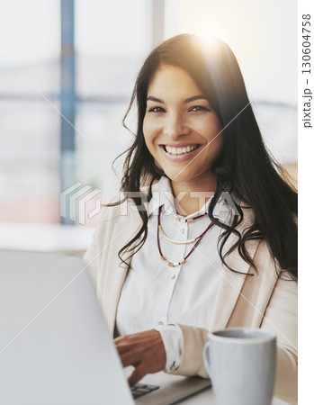 Happy, laptop and portrait of woman in office for email, research and social media news. Website, technology and internet with corporate employee at desk for networking, information and connection 130604758