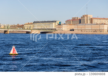 A scenic view of Neva river with a red marker buoy in the foreground 130604808