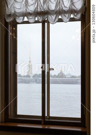 A peaceful view of a river and distant landmarks of Saint-Petersburg 130604809