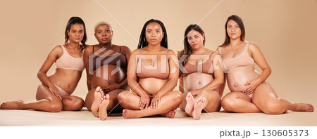 Pregnant, portrait and sitting women in underwear for community bonding, diversity support or body empowerment. Floor, pregnancy or friends in healthcare wellness, strong mindset or mothers day pride 130605373