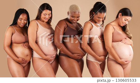 Happy women, body or holding pregnancy stomach in support line, solidarity or community diversity on studio background. Pregnant, friends or mothers underwear for belly growth or healthcare wellness Happy women, body or holding pregnancy stomach in support line, solidarity or community diversity on studio background. Pregnant, friends or mothers underwear for belly growth or healthcare wellness 130605533
