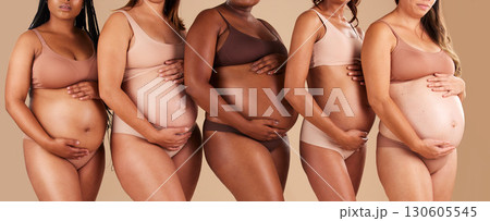 Pregnancy, body or women touching stomach in support, love or community diversity on studio background. Pregnant, friends or mothers in underwear for belly growth, empowerment or healthcare wellness 130605545