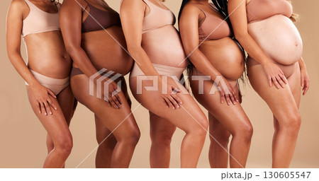 Pregnant body, women or stomach in row on studio background in community, diversity or baby support group. Friends, people or bonding mothers in underwear for belly growth or healthcare development Pregnant body, women or stomach in row on studio background in community, diversity or baby support group. Friends, people or bonding mothers in underwear for belly growth or healthcare development 130605547