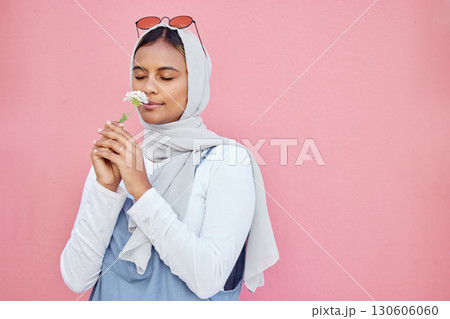 Young Islamic girl, smell flower and modern gen z or millennial fashion, zen freedom and calm peace in pink background. Muslim female, flowers scent and hijab with trendy or edgy clothes in studio Young Islamic girl, smell flower and modern gen z or millennial fashion, zen freedom and calm peace in pink background. Muslim female, flowers scent and hijab with trendy or edgy clothes in studio 130606060