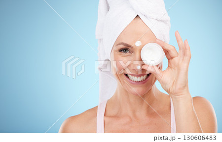 Cream, jar and portrait of woman skincare for face, smile or cosmetics on mockup blue background. Facial lotion, beauty and model with container of healthy glow, shine or advertising aesthetic makeup Cream, jar and portrait of woman skincare for face, smile or cosmetics on mockup blue background. Facial lotion, beauty and model with container of healthy glow, shine or advertising aesthetic makeup 130606483