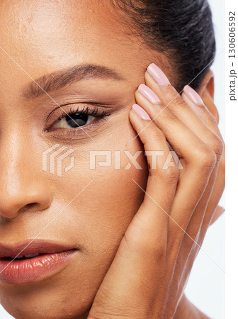 Beauty, skincare and zoom face of black woman in studio for wellness, healthy skin and dermatology. Self care, spa aesthetic and portrait of girl with cosmetics, makeup products and facial treatment Beauty, skincare and zoom face of black woman in studio for wellness, healthy skin and dermatology. Self care, spa aesthetic and portrait of girl with cosmetics, makeup products and facial treatment 130606592