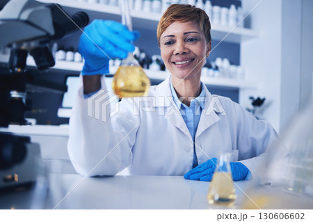 Science, beaker and black woman in laboratory with smile for research, medical study and experiment. Healthcare, biotechnology and female scientist with liquid, medicine and vaccine development 130606602