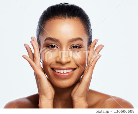 Hands on face, skincare and beauty woman portrait in studio for dermatology, cosmetics and makeup. Aesthetic model happy with a luxury spa facial and natural skin glow isolated on a white background 130606609