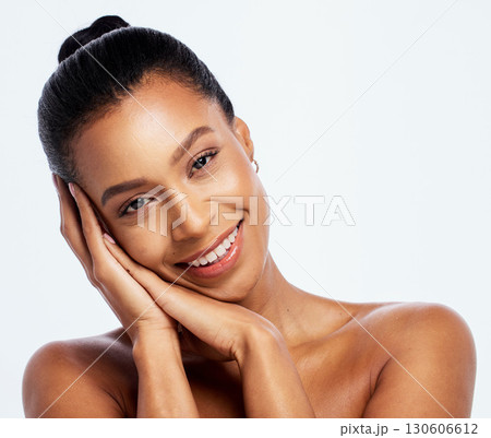 Skin care, beauty and happy face woman portrait in studio for dermatology, cosmetics and natural makeup. Aesthetic model with hands for luxury spa facial and healthy glow isolated on white background Skin care, beauty and happy face woman portrait in studio for dermatology, cosmetics and natural makeup. Aesthetic model with hands for luxury spa facial and healthy glow isolated on white background 130606612