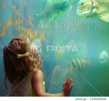 Children, aquarium and sustainability with a girl looking into a fish tank for conservation, learning or development. Kids, water and nature with a female child watching marine life swim underwater 130606686