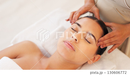 Woman, relax and spa head massage for wellness, health and skincare treatment. Beauty, salon and hands of therapist healing in facial therapy, peace and calm in zen for luxury service of body care 130606772
