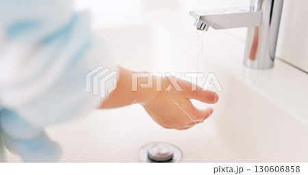 Cleaning, child and girl washing hands in the bathroom with soap for hygiene, healthcare and independence at home. Young, water and healthy kid doing sanitary routine at a sink for toxic bacteria 130606858