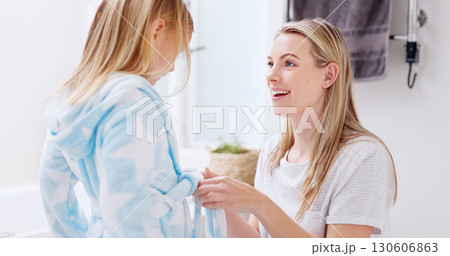Mother, help and child with bathrobe in bathroom for cleaning, wellness and hygiene in the morning in home together. Smile, care and woman talking with kid after shower, washing and relax for beauty Mother, help and child with bathrobe in bathroom for cleaning, wellness and hygiene in the morning in home together. Smile, care and woman talking with kid after shower, washing and relax for beauty 130606863
