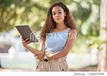 Youth, woman and portrait in park with tablet for research, studying or online streaming. Assertive and confident college girl with digital device for student leisure in nature with bokeh. Youth, woman and portrait in park with tablet for research, studying or online streaming. Assertive and confident college girl with digital device for student leisure in nature with bokeh. 130607944