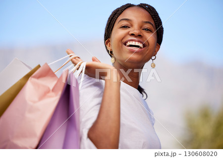 Shopping, black woman and portrait outdoor with retail bags after sale and sales promotion. Happy, smile and excited young person in nature feeling freedom after market deal and fashion mall discount Shopping, black woman and portrait outdoor with retail bags after sale and sales promotion. Happy, smile and excited young person in nature feeling freedom after market deal and fashion mall discount 130608020