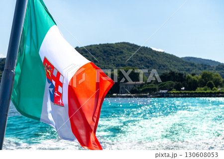 View of an Italian flag in Como lake, Italy travel boat Summer 130608053