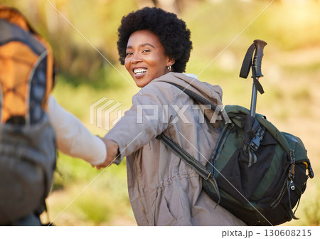 Black woman, holding hands and hiking with smile for travel, adventure or journey with partner in nature. Happy African American female helping friend on hike in support for trekking challenge 130608215
