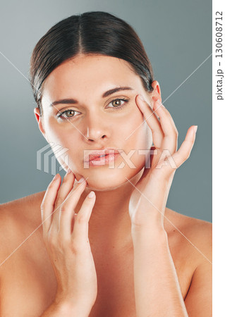 Skincare, beauty wellness and portrait of woman on gray background for cosmetics, facial treatment and spa. Dermatology, aesthetic and face of girl with glowing, healthy and natural skin in studio 130608712