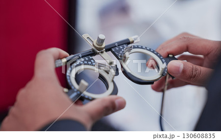 Glasses, trail frame and lens with test and ophthalmologist tools, woman hands zoom with healthcare for eyes and prescription. Optometry, eye care and optometrist, medicine and chart with measurement Glasses, trail frame and lens with test and ophthalmologist tools, woman hands zoom with healthcare for eyes and prescription. Optometry, eye care and optometrist, medicine and chart with measurement 130608835
