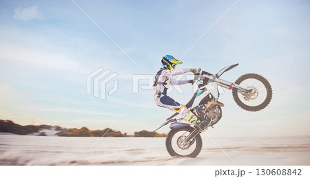 Motorbike, motorcycle athlete and desert drive with mockup cycling in nature for sport adventure. Jump, freedom and sports driving training of a man with speed on sand trail for fitness and exercise 130608842