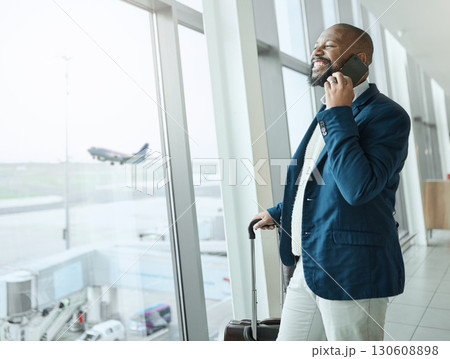 Businessman, phone call and waiting at airport for travel, work trip or plain journey with luggage to country. Happy black man employee or person smile for communication before flight on smartphone 130608898