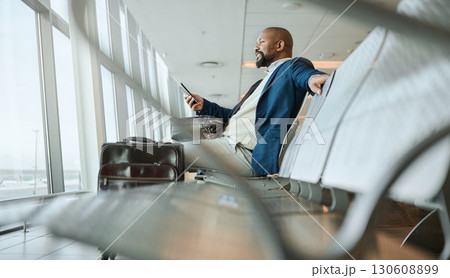 Relax, travel or black man with phone for internet, website search or communication in airport lobby. Smile, happy or girl on tech for communication, networking or social media app in London lounge Relax, travel or black man with phone for internet, website search or communication in airport lobby. Smile, happy or girl on tech for communication, networking or social media app in London lounge 130608899