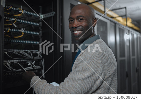 Portrait, server room and black man on tablet for database maintenance or software update at night. Cybersecurity, face or it male engineer coder on tech for programming or networking in data center Portrait, server room and black man on tablet for database maintenance or software update at night. Cybersecurity, face or it male engineer coder on tech for programming or networking in data center 130609017