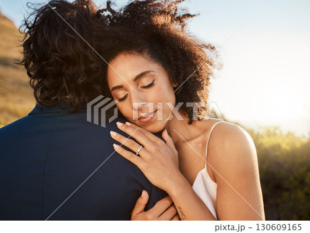 Wedding, bride and groom hug at sunset with embrace together for care, love and support in married life. Marriage, black woman and man at romantic marriage event in Cape Town, South Africa nature. Wedding, bride and groom hug at sunset with embrace together for care, love and support in married life. Marriage, black woman and man at romantic marriage event in Cape Town, South Africa nature. 130609165