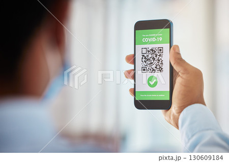 Covid 19 vaccine, man and phone qr code for security, safety or travel during corona virus pandemic. Digital app software, health certificate and confirmation tick, check mark or verification success 130609184