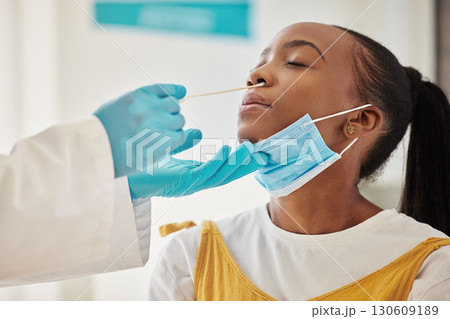 Covid 19 test, doctor hands and black woman for hospital healthcare, medical support and corona virus exam. PCR, safety consultation girl or face of patient with nose swab from clinic worker or nurse Covid 19 test, doctor hands and black woman for hospital healthcare, medical support and corona virus exam. PCR, safety consultation girl or face of patient with nose swab from clinic worker or nurse 130609189