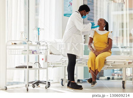 Covid, healthcare and test with a black woman patient talking to a doctor for consulting during a checkup. Compliance, medical and insurance with a female in a hospital testing for the corona virus 130609214