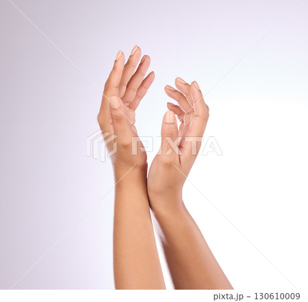 Hands, nails and beauty, woman with nail polish, manicure and makeup with cosmetics on studio background. Skincare, moisturizer with mockup and dermatology with lotion cosmetic product and female 130610009