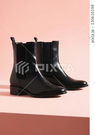 Fashionable black chelsea shoes. leather boots still life 130610199