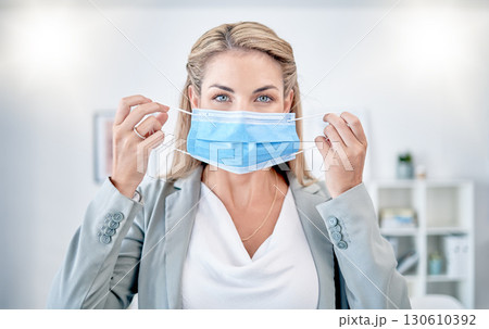 Woman, office portrait and put on mask for covid 19 safety, health and stop spread in workplace. Corporate leader, manager and wellness in workspace with blurred background, ppe and self care at job Woman, office portrait and put on mask for covid 19 safety, health and stop spread in workplace. Corporate leader, manager and wellness in workspace with blurred background, ppe and self care at job 130610392