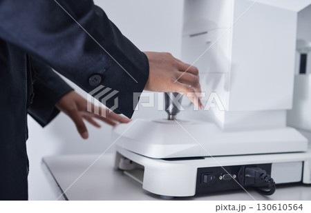 Ophthalmologist, glaucoma and optometrist hands on machine for eye exam for vision care, health and wellness. Closeup, professional and healthcare specialist test lenses for optometry in clinic Ophthalmologist, glaucoma and optometrist hands on machine for eye exam for vision care, health and wellness. Closeup, professional and healthcare specialist test lenses for optometry in clinic 130610564