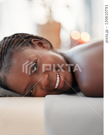 Relax, spa and portrait of black woman in massage bed for wellness, peace or luxury zen. Face, girl and resort for body care, therapy and pamper treatment, happy and smile with stress free relaxation Relax, spa and portrait of black woman in massage bed for wellness, peace or luxury zen. Face, girl and resort for body care, therapy and pamper treatment, happy and smile with stress free relaxation 130610791