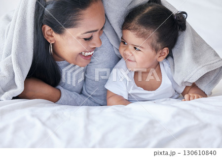 Happy, morning and mother with a baby and blanket for comfort, relaxing and laughing together. Smile, cute and mom resting in bed with a child while bonding, playing and quality time with a kid Happy, morning and mother with a baby and blanket for comfort, relaxing and laughing together. Smile, cute and mom resting in bed with a child while bonding, playing and quality time with a kid 130610840