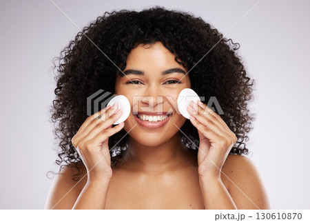Beauty, cotton pad and portrait of black woman with smile for wellness, skincare and healthy glow. Dermatology, self care and happy face of girl with swab for makeup, cosmetics and facial cleaning Beauty, cotton pad and portrait of black woman with smile for wellness, skincare and healthy glow. Dermatology, self care and happy face of girl with swab for makeup, cosmetics and facial cleaning 130610870