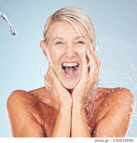 Shower, face and old woman excited with water, skin cleaning and antiaging skincare with elderly model isolated on studio background. Beauty, senior cosmetic care and facial portrait, wow and hygiene 130610890
