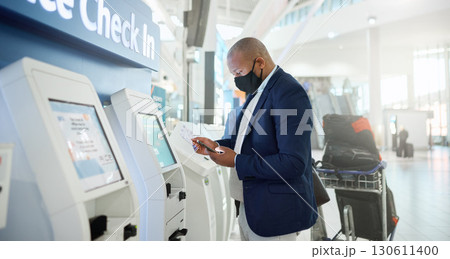 Black man, mask and checking phone in airport for corporate travel information, destination details and flight ticket. African businessman, digital communication and smartphone, check in and safety 130611400