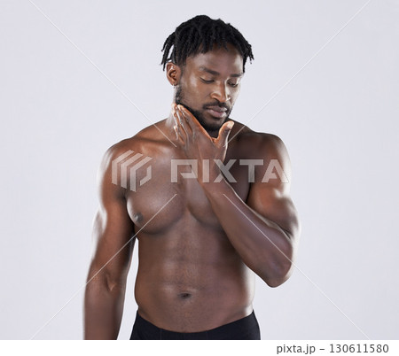 Black man, skincare and fitness portrait with body sports person in studio for strong muscle and power. Health and wellness of a sexy male bodybuilder with growth after exercise, workout and training Black man, skincare and fitness portrait with body sports person in studio for strong muscle and power. Health and wellness of a sexy male bodybuilder with growth after exercise, workout and training 130611580