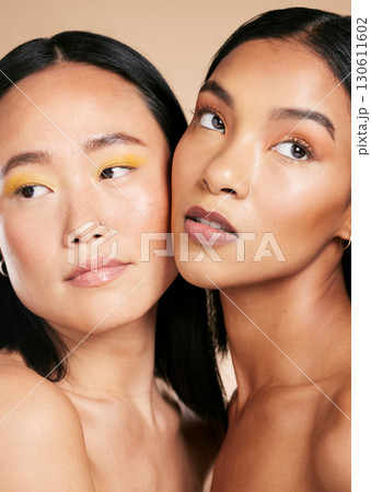 Makeup, beauty and face with skincare glow for diversity of skin and cosmetic self care. Magazine, dermatology and spa treatment for friends or models isolated against a brown studio background Makeup, beauty and face with skincare glow for diversity of skin and cosmetic self care. Magazine, dermatology and spa treatment for friends or models isolated against a brown studio background 130611602
