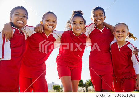 Football girl, group portrait and field for smile, team building happiness and solidarity at sport training. Female kids, sports diversity and friends with teamwork, learning or soccer with low angle 130611963