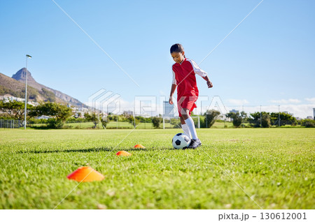 Football girl kid, training and grass for fitness, speed or balance with sport talent development, control and speed. Female child, fast football dribbling or motivation mindset on field in Cape Town Football girl kid, training and grass for fitness, speed or balance with sport talent development, control and speed. Female child, fast football dribbling or motivation mindset on field in Cape Town 130612001