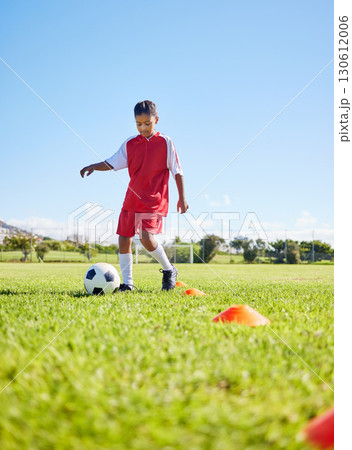 Football girl kid, grass and training for fitness, sports or balance with talent development, control or speed. Female child, fast football dribbling and exercise feet on field with strong mindset Football girl kid, grass and training for fitness, sports or balance with talent development, control or speed. Female child, fast football dribbling and exercise feet on field with strong mindset 130612006