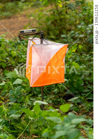 Orienteering. Control point Prism and electric composter for orienteering in the autumn forest. 130612258