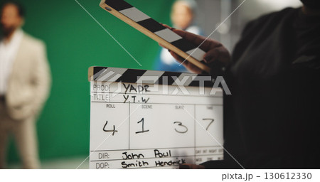 Person, hands and production studio with clapperboard for action, take or behind the scenes in set. Closeup, director or producer with movie slate, green screen or reel for film cut, number or roll Person, hands and production studio with clapperboard for action, take or behind the scenes in set. Closeup, director or producer with movie slate, green screen or reel for film cut, number or roll 130612330