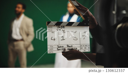 Person, producer and hands with clapperboard on set for take, action or camera roll in production. Closeup, director or assistant with movie slate for film making, videography edit or start scene Person, producer and hands with clapperboard on set for take, action or camera roll in production. Closeup, director or assistant with movie slate for film making, videography edit or start scene 130612337