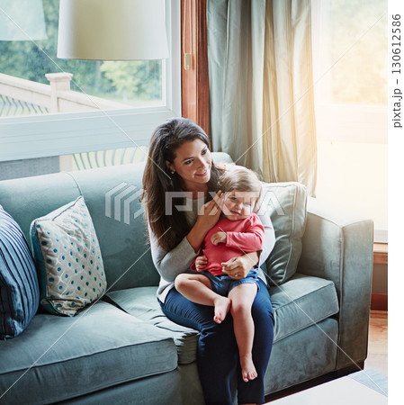 Relax, happy and smile with mother and baby on sofa for bonding, quality time and child development. Growth, support and trust with mom and daughter in family home for health, connection and care Relax, happy and smile with mother and baby on sofa for bonding, quality time and child development. Growth, support and trust with mom and daughter in family home for health, connection and care 130612586
